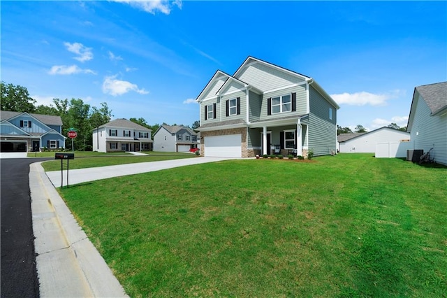 22 Mossy Oaks Ln NE, Rome, GA 30165 - view of front of house with driveway, central AC unit, a front yard, a garage, and a residential view