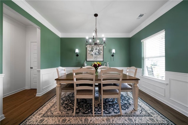 22 Mossy Oaks Ln NE, Rome, GA 30165 - dining room with dark wood-style flooring, a wainscoted wall, a chandelier, crown molding, and a decorative wall