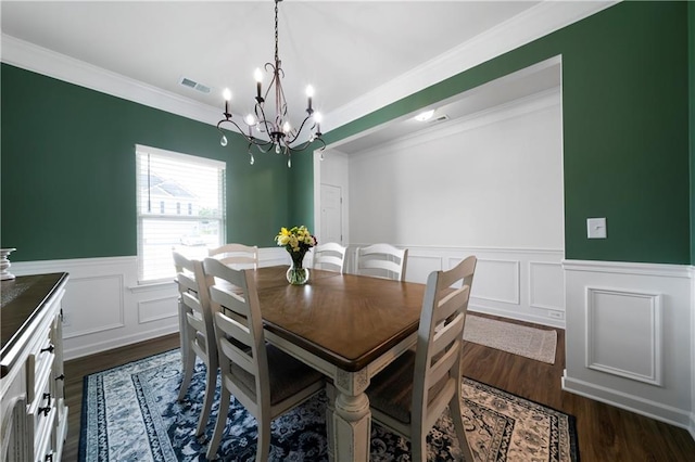 22 Mossy Oaks Ln NE, Rome, GA 30165 - dining area with a chandelier, wainscoting, ornamental molding, dark wood finished floors, and a decorative wall