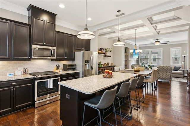 kitchen with stainless steel appliances, coffered ceiling, open floor plan, backsplash, and dark wood finished floors