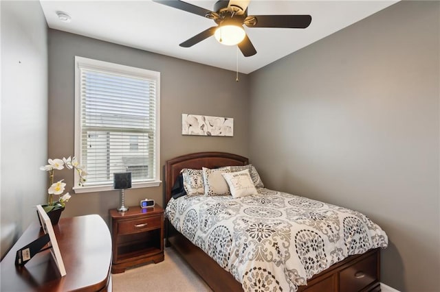 bedroom featuring light carpet and ceiling fan