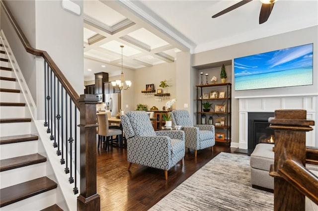 living room featuring coffered ceiling, wood finished floors, stairs, crown molding, and beam ceiling