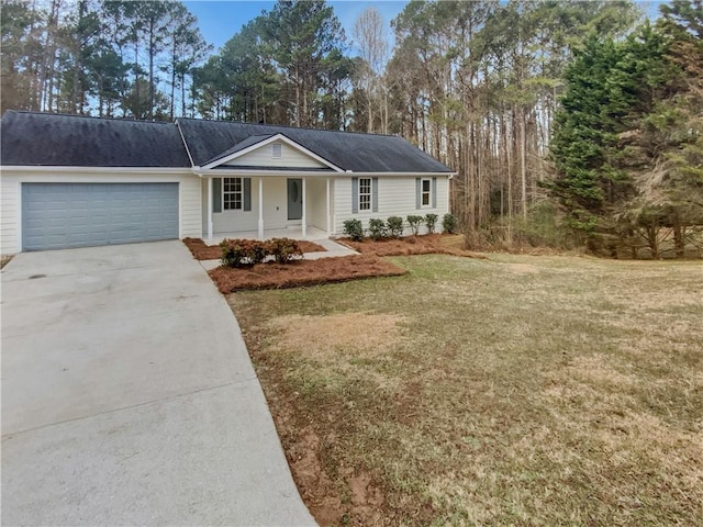 ranch-style house featuring a front lawn, a garage, covered porch, and driveway