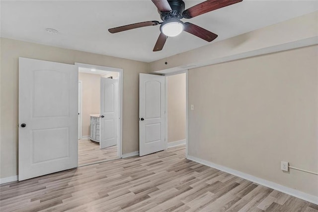 unfurnished bedroom featuring light wood-style floors, baseboards, and a ceiling fan