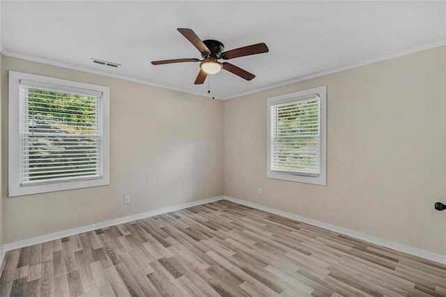 unfurnished room with crown molding and baseboards