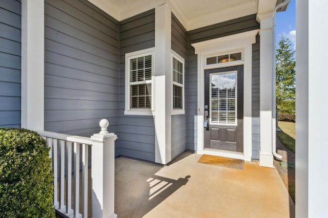 property entrance featuring a porch
