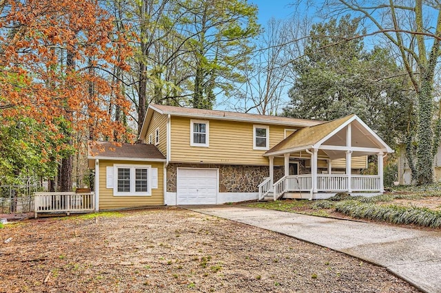 view of front of home featuring a garage and a porch