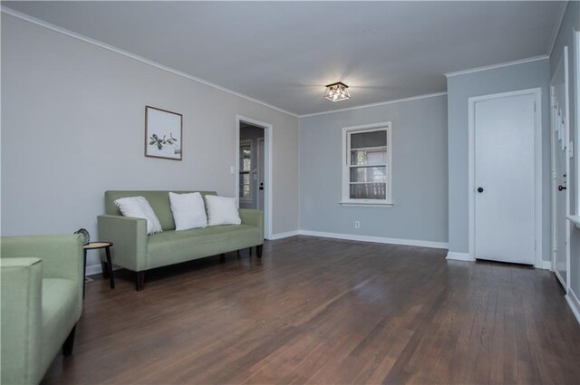 unfurnished room featuring ornamental molding, dark wood-type flooring, and ceiling fan