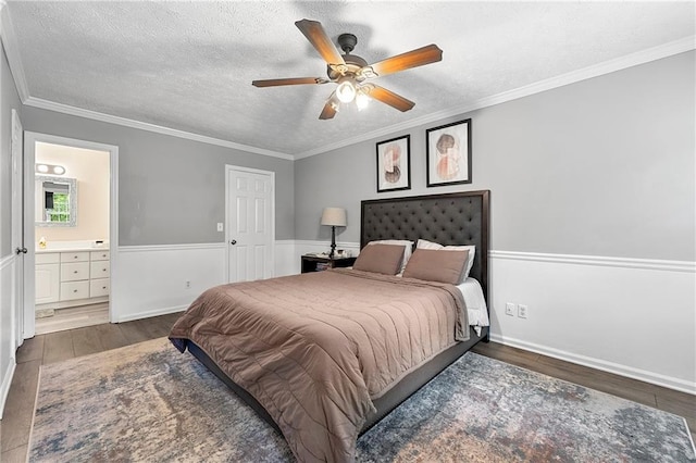 4131 N Gloucester Pl, Atlanta, GA 30341 - bedroom featuring wood finished floors, a textured ceiling, connected bathroom, crown molding, and a ceiling fan