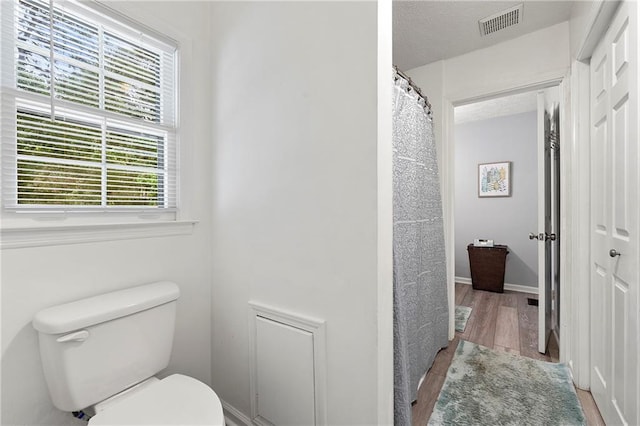 4131 N Gloucester Pl, Atlanta, GA 30341 - full bathroom featuring toilet and wood finished floors