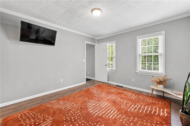 4131 N Gloucester Pl, Atlanta, GA 30341 - empty room featuring wood finished floors, crown molding, a textured ceiling, and baseboards