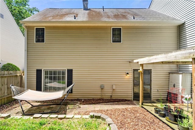 4131 N Gloucester Pl, Atlanta, GA 30341 - back of property with a patio area and a shingled roof