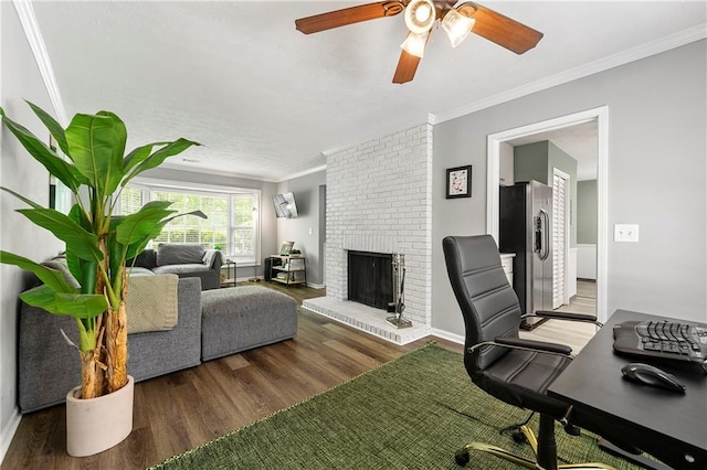 4131 N Gloucester Pl, Atlanta, GA 30341 - office with ornamental molding, wood finished floors, a ceiling fan, a brick fireplace, and baseboards