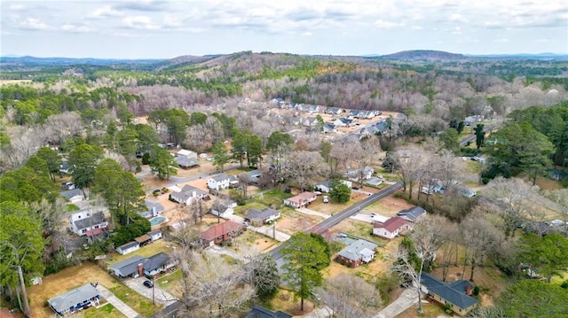 aerial view with a mountain view and a forest view