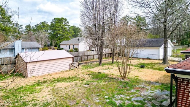 view of yard with an outbuilding and a fenced backyard