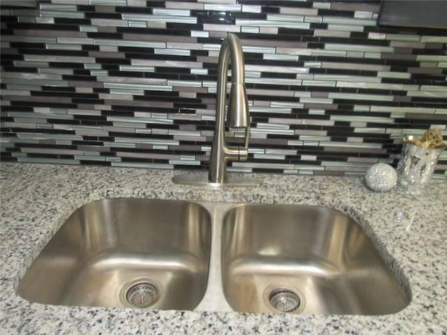 3086 Lone Oak Ave SW, Atlanta, GA 30354 - kitchen view of a sink, backsplash, and light stone countertops