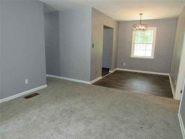 3086 Lone Oak Ave SW, Atlanta, GA 30354 - unfurnished room with carpet floors, baseboards, and a chandelier