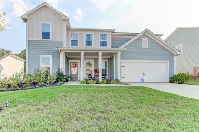 view of front of home with a front lawn, a porch, and a garage