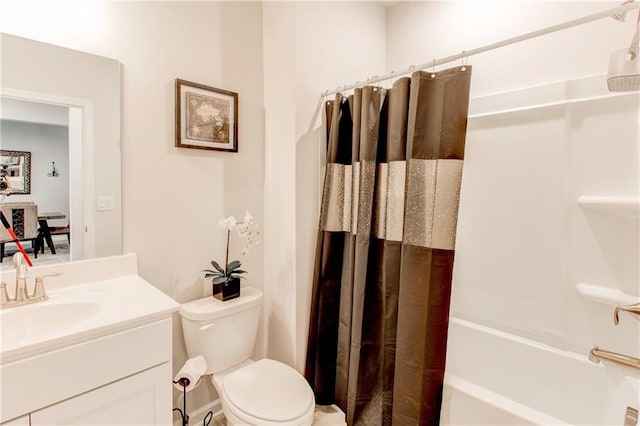 full bathroom featuring shower / bath combo, vanity, and toilet