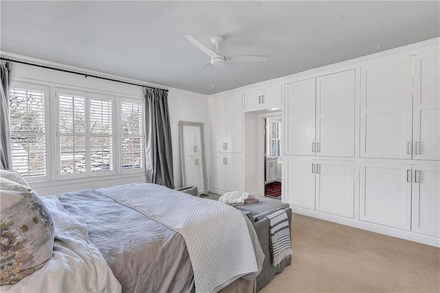 carpeted bedroom with ceiling fan