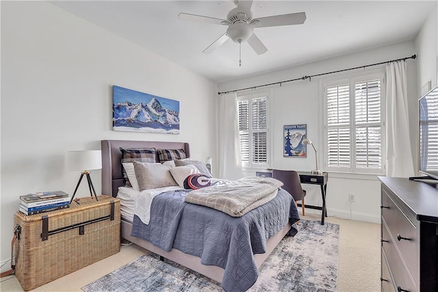 bedroom with light carpet and ceiling fan