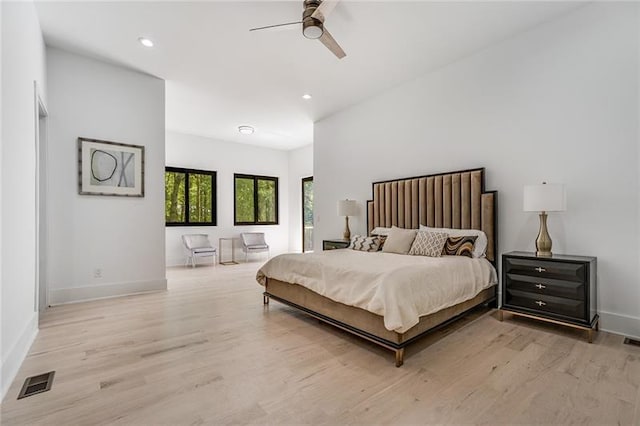 bedroom featuring ceiling fan and light wood-type flooring