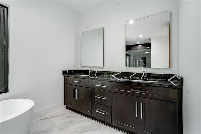 bathroom with a tub to relax in, tile patterned flooring, and double vanity