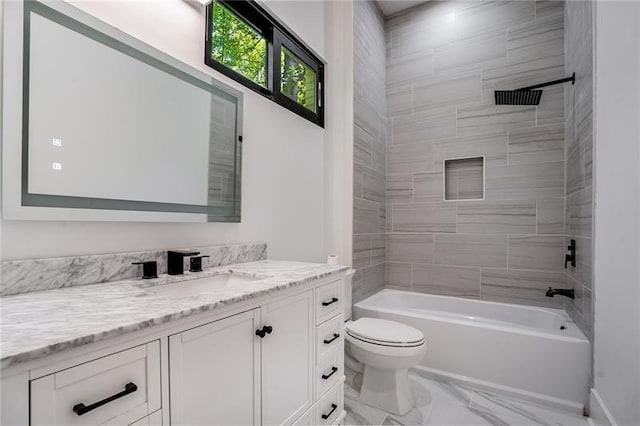 full bathroom with vanity, tiled shower / bath combo, toilet, and tile patterned floors