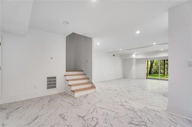 basement with light tile patterned floors