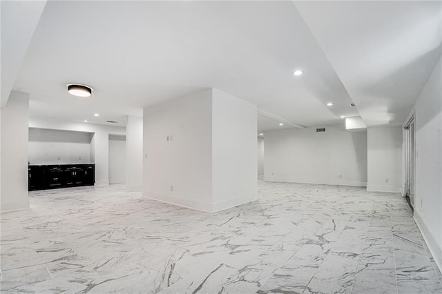 basement featuring light tile patterned floors