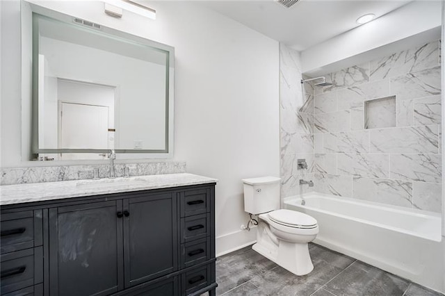 full bathroom with tiled shower / bath combo, tile patterned floors, toilet, and vanity