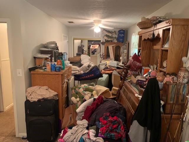 misc room featuring ceiling fan and carpet flooring