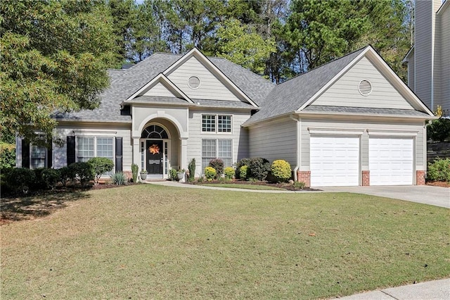 view of front of house with a garage and a front yard