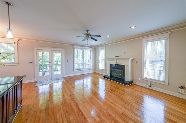 3416 Harrison Rd, Atlanta, GA 30344 - unfurnished living room with a ceiling fan, ornamental molding, light wood-style flooring, baseboards, and a glass covered fireplace