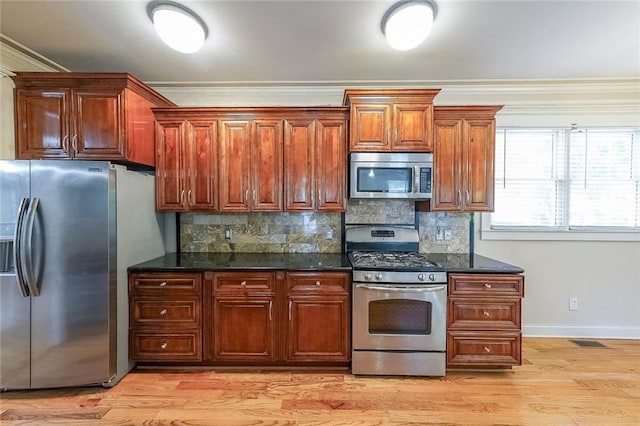 3416 Harrison Rd, Atlanta, GA 30344 - kitchen with appliances with stainless steel finishes, ornamental molding, decorative backsplash, baseboards, and light wood-style floors
