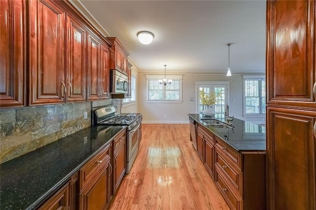 3416 Harrison Rd, Atlanta, GA 30344 - kitchen with stainless steel appliances, a sink, light wood-style flooring, baseboards, and ornamental molding