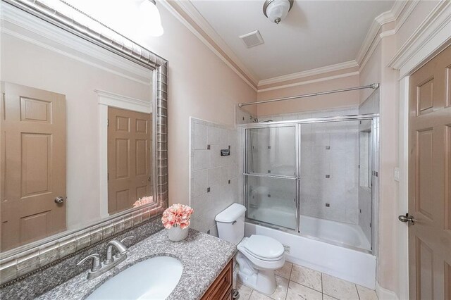3416 Harrison Rd, Atlanta, GA 30344 - full bathroom featuring toilet, crown molding, vanity, enclosed tub / shower combo, and tile patterned floors
