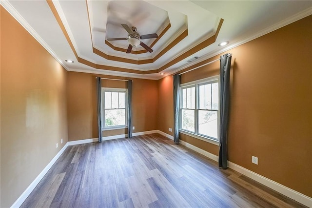 3416 Harrison Rd, Atlanta, GA 30344 - empty room featuring ornamental molding, a tray ceiling, ceiling fan, wood finished floors, and baseboards