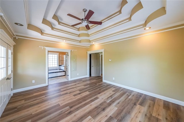 3416 Harrison Rd, Atlanta, GA 30344 - empty room featuring a ceiling fan, a raised ceiling, ornamental molding, wood finished floors, and baseboards