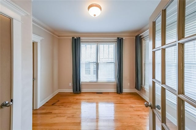 3416 Harrison Rd, Atlanta, GA 30344 - spare room featuring light wood finished floors, crown molding, and baseboards