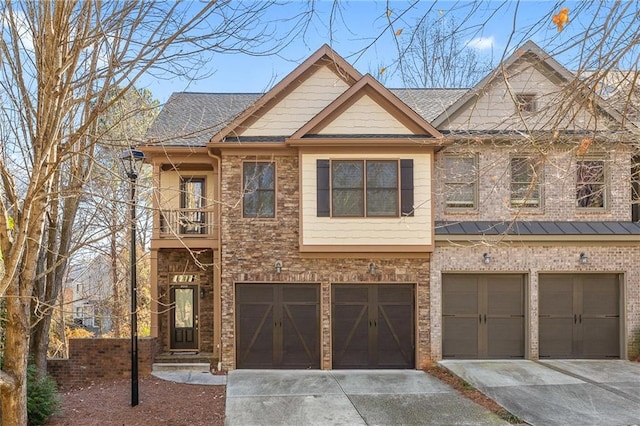 view of front of house featuring a balcony and a garage