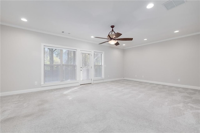 unfurnished room with ceiling fan, ornamental molding, and light carpet