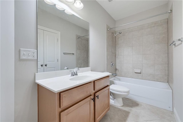 full bathroom featuring tile patterned floors, vanity, toilet, and tiled shower / bath