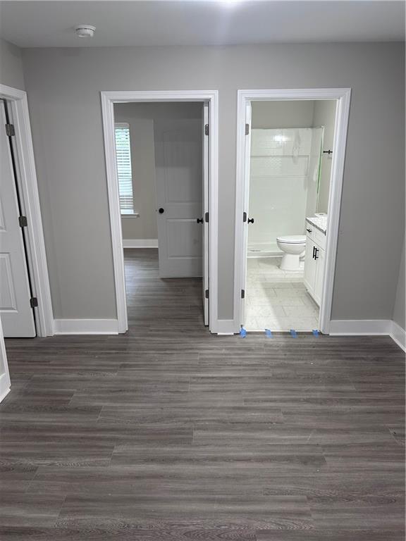 209 Trade Way, Dalton, GA 30721 - hallway featuring baseboards and dark wood-type flooring