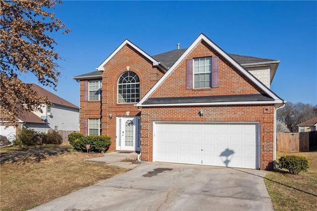 view of front of house with brick siding, concrete driveway, a garage, and fence