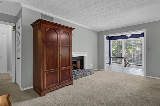 living room with ornamental molding, light colored carpet, and a textured ceiling