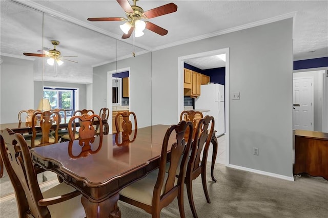 dining space featuring crown molding and carpet