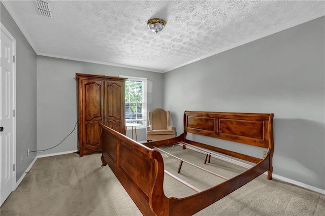 bedroom with ornamental molding, light carpet, and a textured ceiling