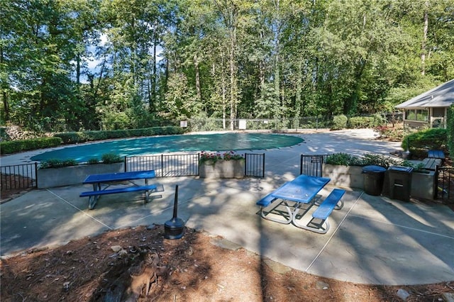 view of swimming pool featuring a patio