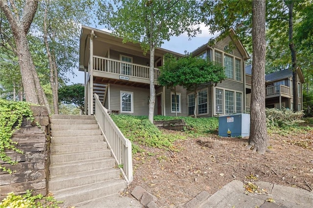 view of front of property with a balcony